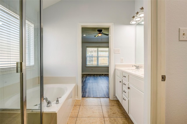 2144 Callahan Dr, Forney, TX 75126 - full bathroom with vanity, ceiling fan, a garden tub, and tile patterned flooring