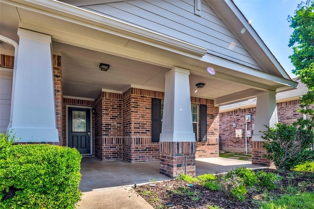 2144 Callahan Dr, Forney, TX 75126 - view of exterior entry with a porch and brick siding
