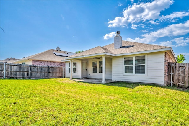 2144 Callahan Dr, Forney, TX 75126 - back of property with a patio area, a ceiling fan, a chimney, and roof with shingles