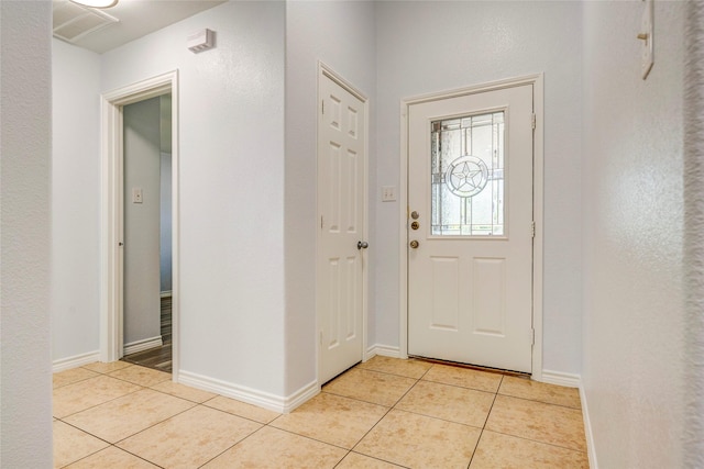 2144 Callahan Dr, Forney, TX 75126 - foyer with light tile patterned floors and baseboards