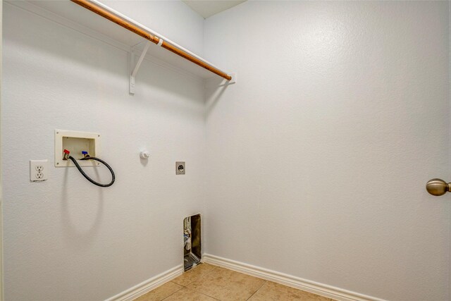 2144 Callahan Dr, Forney, TX 75126 - laundry area featuring hookup for a washing machine, hookup for an electric dryer, light tile patterned floors, baseboards, and gas dryer hookup
