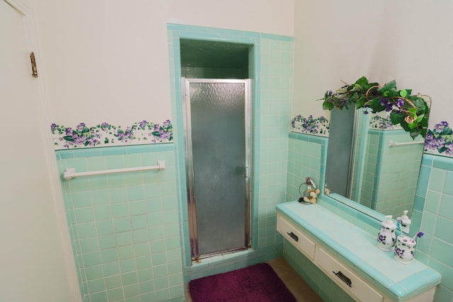 1000 S Harrison St, Mcgregor, TX 76657 - bathroom featuring tile walls, wainscoting, and a stall shower