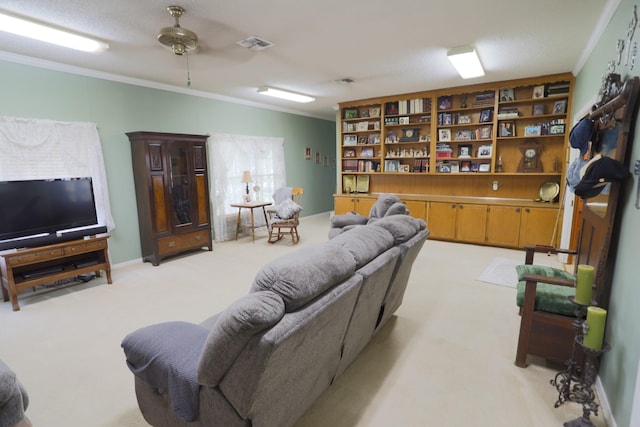 1000 S Harrison St, Mcgregor, TX 76657 - living room featuring ornamental molding, light carpet, and a ceiling fan