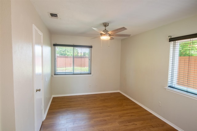 417 Red Coat Ln, Arlington, TX 76002 - spare room with wood finished floors, a ceiling fan, and baseboards