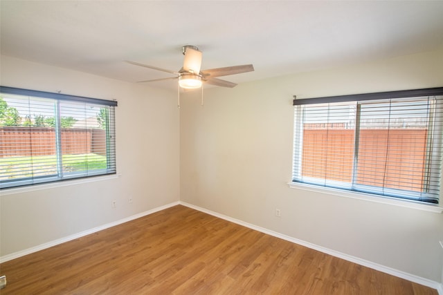 417 Red Coat Ln, Arlington, TX 76002 - spare room featuring baseboards, light wood-type flooring, and ceiling fan