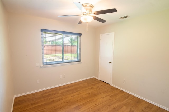 417 Red Coat Ln, Arlington, TX 76002 - unfurnished room with light wood-style floors, ceiling fan, and baseboards