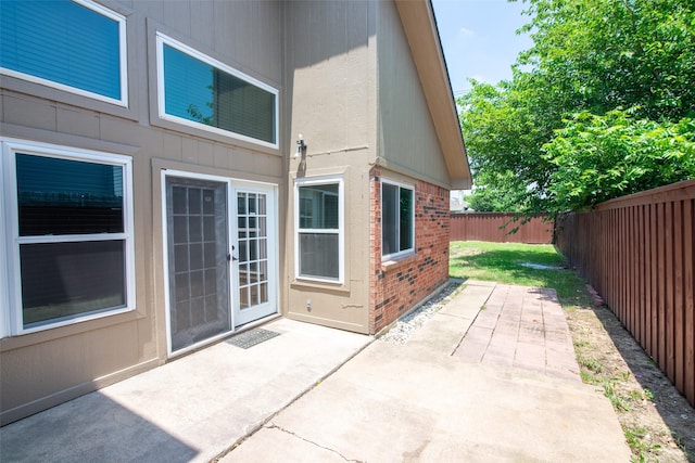 417 Red Coat Ln, Arlington, TX 76002 - fenced backyard with a patio area