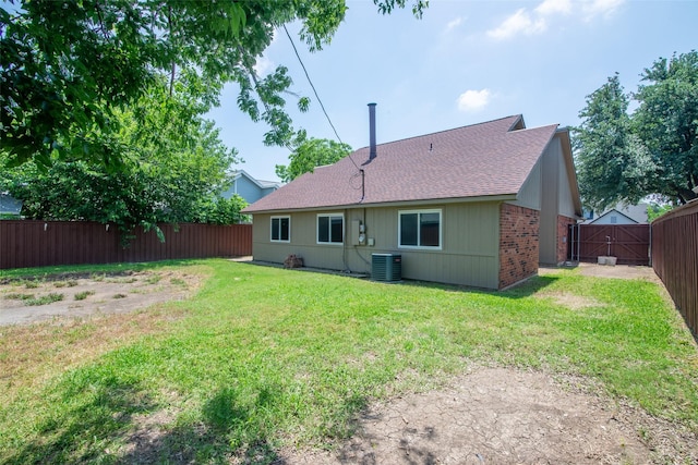 417 Red Coat Ln, Arlington, TX 76002 - back of house featuring central AC, roof with shingles, a gate, and brick siding