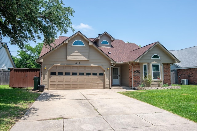 417 Red Coat Ln, Arlington, TX 76002 - traditional home with central AC unit, a garage, concrete driveway, brick siding, and roof with shingles