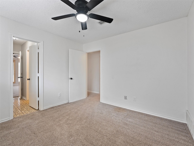 4509 Trowbridge Dr, Arlington, TX 76013 - unfurnished bedroom with carpet floors, a textured ceiling, baseboards, and a ceiling fan