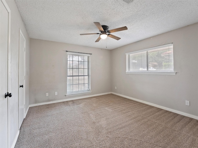 4509 Trowbridge Dr, Arlington, TX 76013 - carpeted spare room featuring a ceiling fan, a textured ceiling, and baseboards