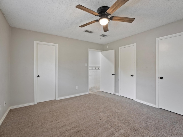 4509 Trowbridge Dr, Arlington, TX 76013 - unfurnished bedroom featuring carpet flooring, a textured ceiling, baseboards, and a ceiling fan
