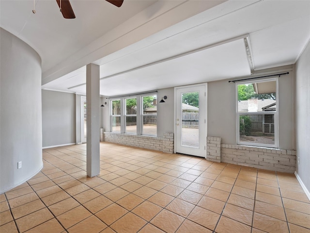 4509 Trowbridge Dr, Arlington, TX 76013 - empty room with light tile patterned floors, a ceiling fan, and plenty of natural light