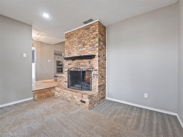 4509 Trowbridge Dr, Arlington, TX 76013 - unfurnished living room featuring a textured ceiling, carpet, a fireplace, baseboards, and recessed lighting