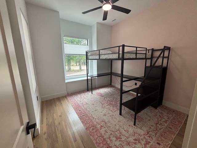 5073 Loper Cir, Streetman, TX 75859 - bedroom with wood finished floors and baseboards