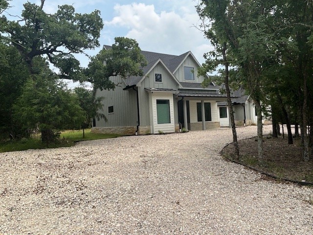 5073 Loper Cir, Streetman, TX 75859 - modern farmhouse with driveway and board and batten siding