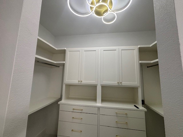 5073 Loper Cir, Streetman, TX 75859 - spacious closet with a chandelier