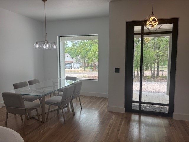 5073 Loper Cir, Streetman, TX 75859 - dining space featuring healthy amount of natural light, baseboards, and wood finished floors