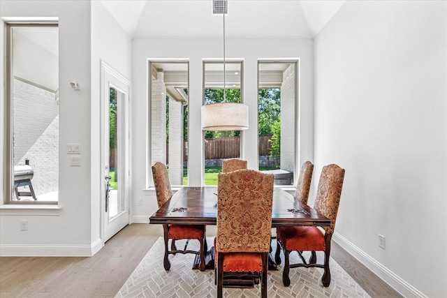 806 Placid Way, Argyle, TX 76226 - dining area with plenty of natural light, lofted ceiling, and wood finished floors