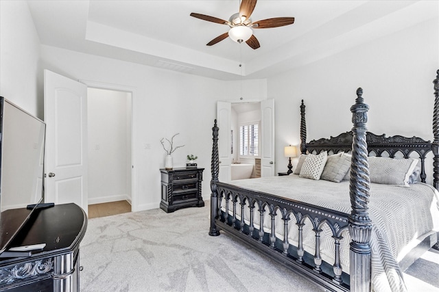 806 Placid Way, Argyle, TX 76226 - carpeted bedroom featuring a raised ceiling, baseboards, and a ceiling fan
