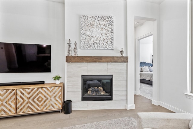806 Placid Way, Argyle, TX 76226 - living room featuring wood finished floors, baseboards, and a fireplace