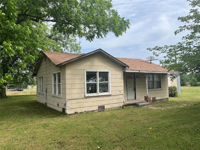 3743 State Highway 59 N, Bowie, TX 76230 - bungalow featuring a front yard and a shingled roof