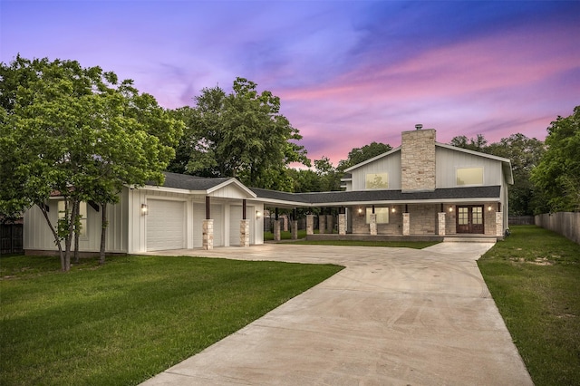 6701 Fish Pond Rd, Waco, TX 76710 - view of front of home featuring a garage, concrete driveway, a chimney, a porch, and stone siding