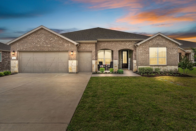 712 Freedom Ln, Little Elm, TX 76227 - view of front of home with brick siding, a garage, concrete driveway, and roof with shingles
