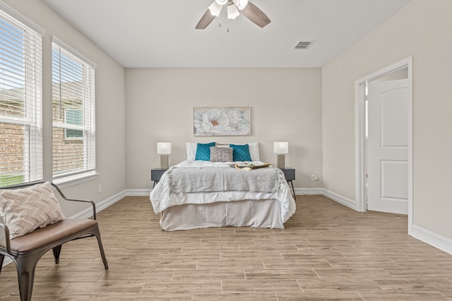 712 Freedom Ln, Little Elm, TX 76227 - bedroom with light wood-style floors, baseboards, and a ceiling fan