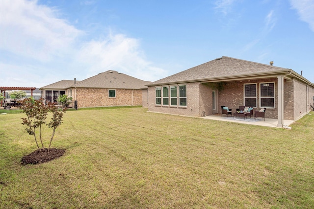 712 Freedom Ln, Little Elm, TX 76227 - rear view of house with brick siding, a patio, a yard, and outdoor lounge area