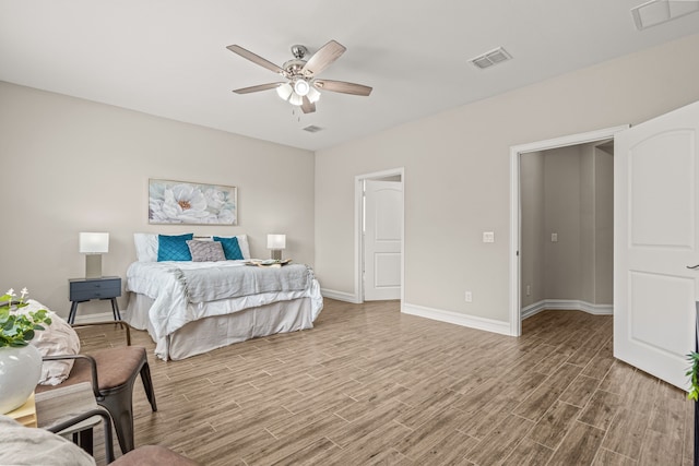 712 Freedom Ln, Little Elm, TX 76227 - bedroom featuring wood finished floors, baseboards, and ceiling fan