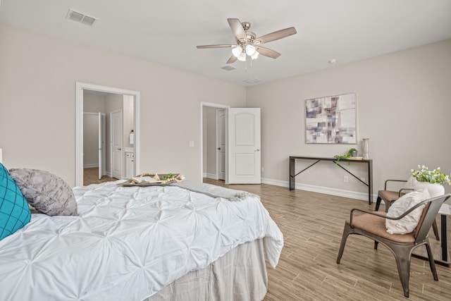 712 Freedom Ln, Little Elm, TX 76227 - bedroom with light wood-style flooring, baseboards, and a ceiling fan