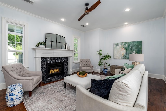 812 Baker St, Mckinney, TX 75069 - living area with a ceiling fan, crown molding, wood finished floors, a fireplace, and recessed lighting
