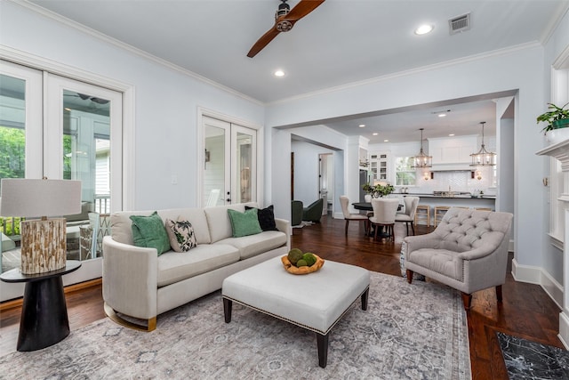 812 Baker St, Mckinney, TX 75069 - living room with a ceiling fan, french doors, wood finished floors, crown molding, and recessed lighting