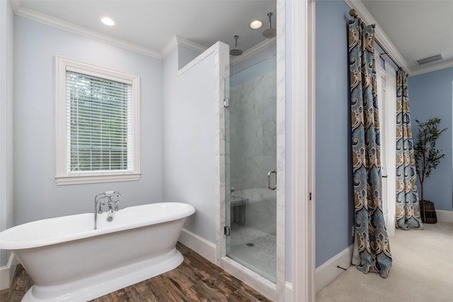 812 Baker St, Mckinney, TX 75069 - full bathroom featuring ornamental molding, a stall shower, a freestanding tub, and recessed lighting