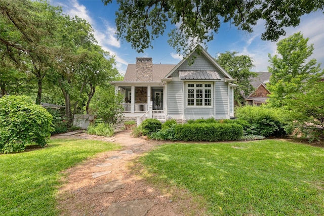 812 Baker St, Mckinney, TX 75069 - view of front of home featuring a front lawn, a chimney, and a porch