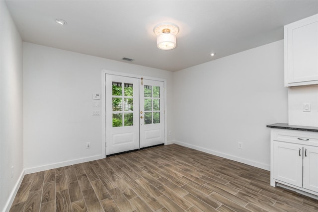812 Baker St, Mckinney, TX 75069 - unfurnished dining area featuring wood finished floors, french doors, and recessed lighting