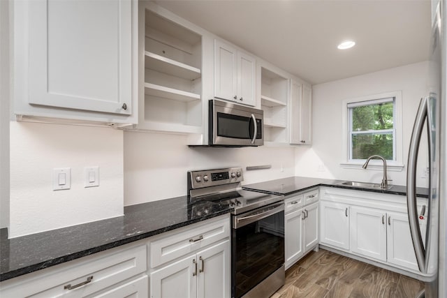 812 Baker St, Mckinney, TX 75069 - kitchen featuring open shelves, stainless steel appliances, white cabinets, dark stone counters, and recessed lighting