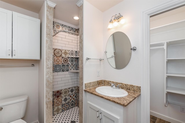 812 Baker St, Mckinney, TX 75069 - bathroom with a tile shower, vanity, and a closet