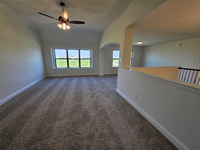 320 Magnolia Ct, Trenton, TX 75490 - carpeted empty room featuring ceiling fan, plenty of natural light, arched walkways, vaulted ceiling, and baseboards