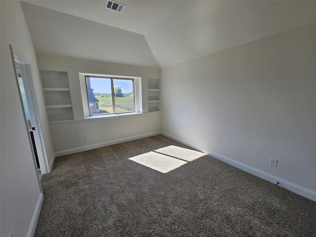 320 Magnolia Ct, Trenton, TX 75490 - spare room with carpet, baseboards, built in features, and vaulted ceiling