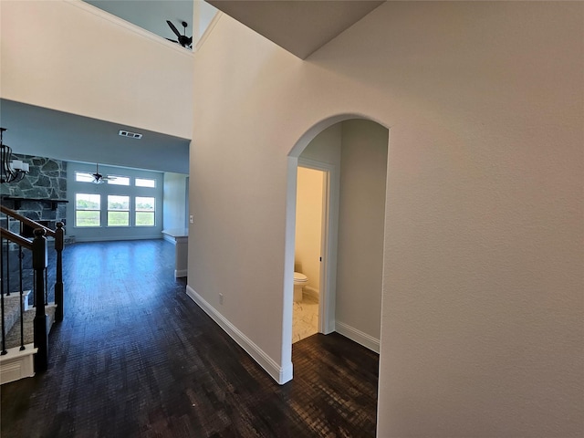 320 Magnolia Ct, Trenton, TX 75490 - corridor with arched walkways, wood finished floors, baseboards, and stairway