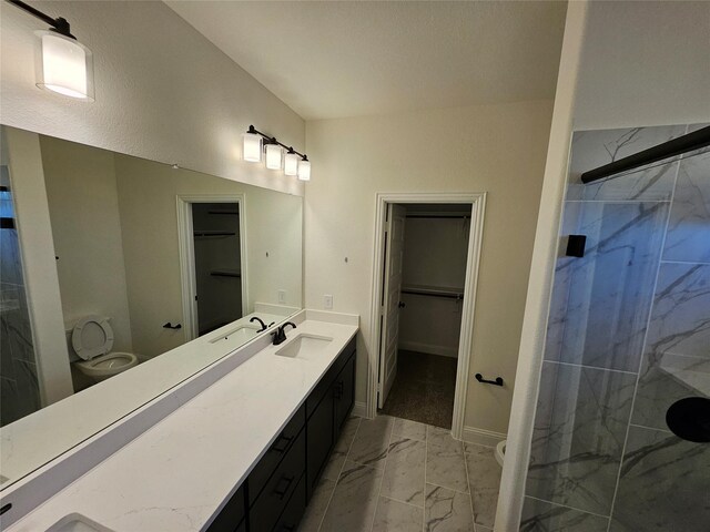 320 Magnolia Ct, Trenton, TX 75490 - full bath featuring marble look tiles, a marble finish shower, a walk in closet, vanity, and baseboards