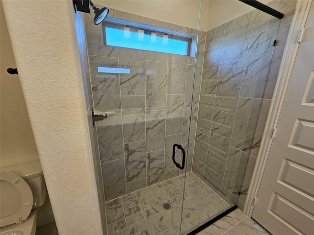 320 Magnolia Ct, Trenton, TX 75490 - bathroom with marble finish flooring, a stall shower, toilet, and a textured wall