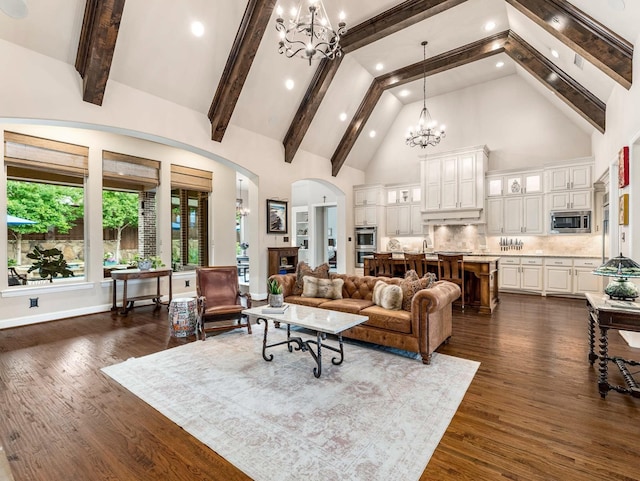 3021 Sunny Hill Ln, Prosper, TX 75078 - living area featuring high vaulted ceiling, a chandelier, arched walkways, dark wood-style flooring, and recessed lighting