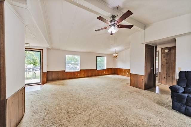 30 The Rdg, Corinth, TX 76210 - unfurnished living room with wooden walls, wainscoting, carpet, a ceiling fan, and a chandelier