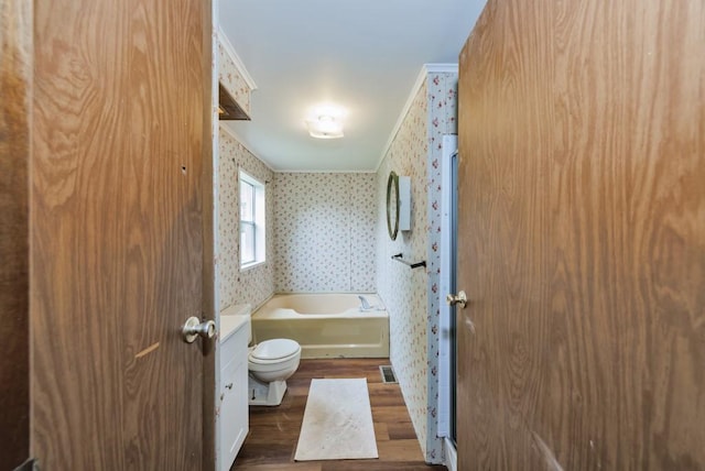 30 The Rdg, Corinth, TX 76210 - full bathroom featuring wood finished floors, a garden tub, wallpapered walls, and toilet