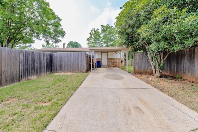 30 The Rdg, Corinth, TX 76210 - view of front of house with a carport and concrete driveway