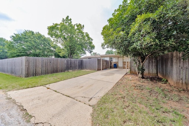 30 The Rdg, Corinth, TX 76210 - fenced yard with driveway and a carport