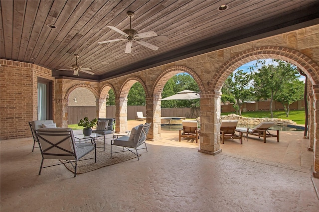 view of patio featuring a fenced backyard, ceiling fan, and an outdoor hangout area